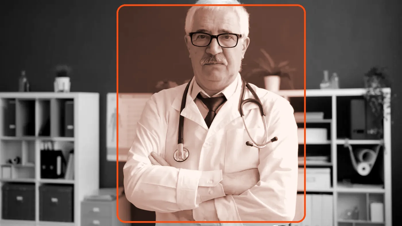 A physician clinic owner in his office