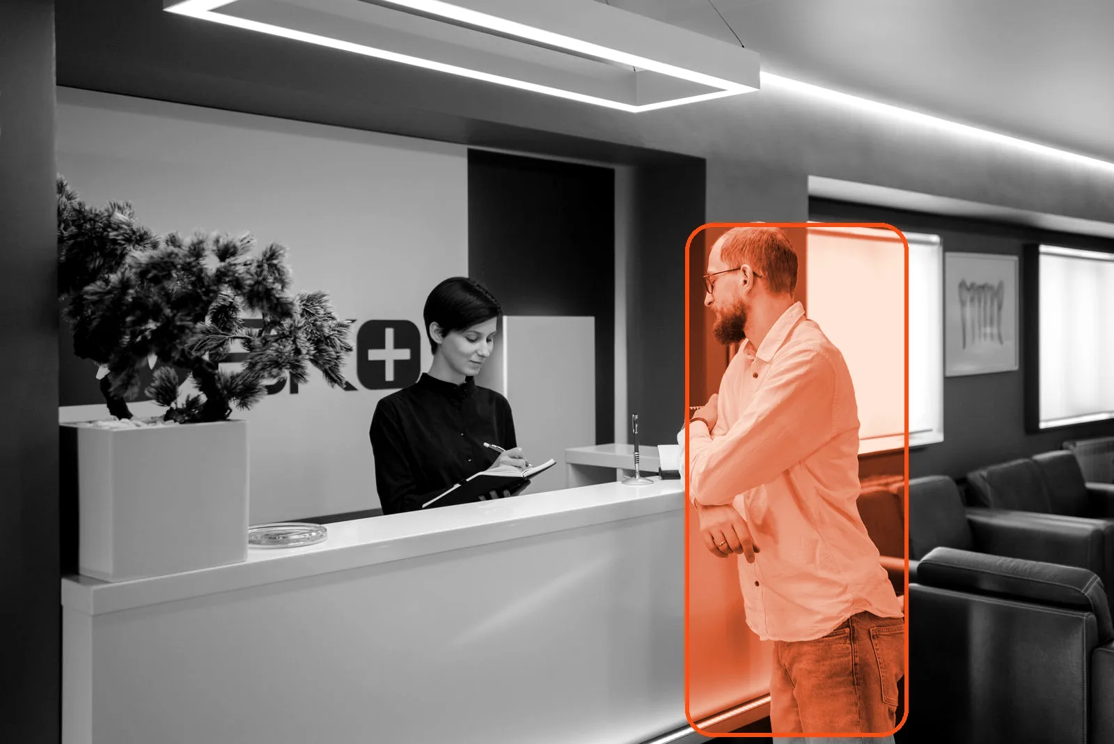 A patient arriving at a clinic front desk